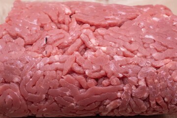 Raw minced beef meat texture close up, fresh ground beef for cooking and food preparation