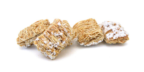 Breakfast setting with frosted wheat cereal on white background 