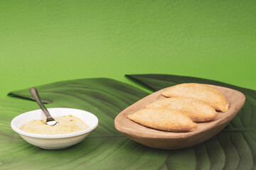 Colombian empanada with spicy sauce 
