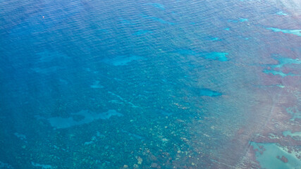 Aerial view of ocean reefs along coastal highway in Maui, Hawaii landscape seascape during morning sunrise