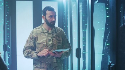 Soldier checks network status digitally, Lone soldier observes live network information through handheld device