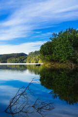 Tranquil Landscape with reflective waters of the Z&ecirc;zere River in Central Portugal in the river beach of Alqueidao - Tomar