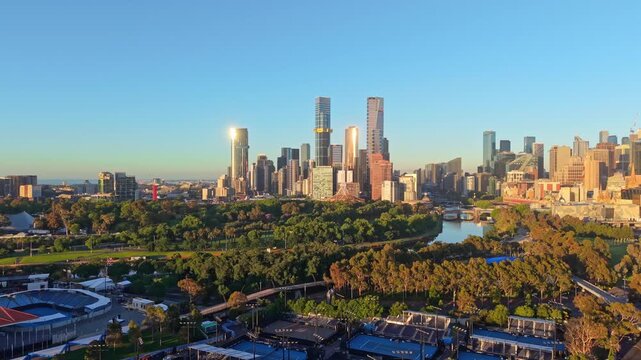 Panning view of Melbourne city skyline and parkland