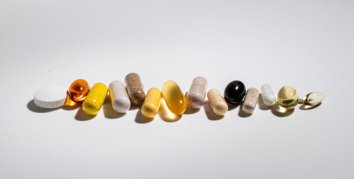 Close up of various  Vitamins and Supplements on Light Background