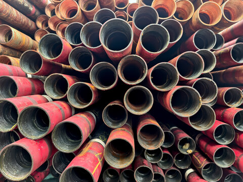 Stack of oilfield tubing taking at pin end connection for oil and gas well completion (exploration and production industry)