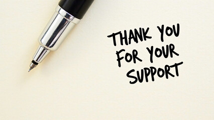 Close-up of fountain pen on light surface—“THANK YOU FOR YOUR SUPPORT” in bold black ink conveys tactile sincerity and handwritten appreciation.
