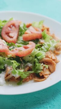 Close-Up of Chicken Kapsalon with Turkish Doner on White Plate