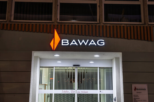 VILLACH, AUSTRIA - DECEMBER 28, 2024: logo of BAWAG PSK bank on their branch office in Villach, at night. Bawag PSK is an Austrian retail and commercial bank, the fourth largest in the country.