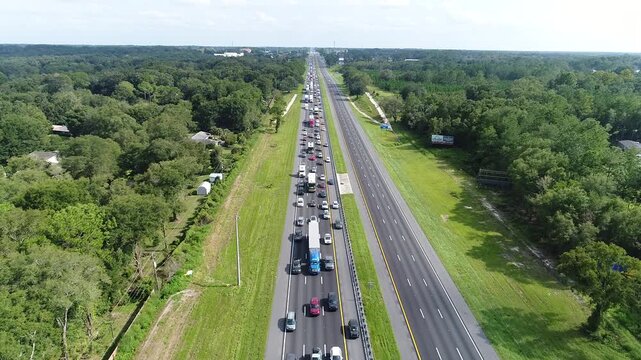 Vehicles leaving Florida as hurricane is on the way. One lane packed while lanes heading towards the area being hit are mostly empty.