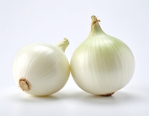 Two large white onions, fresh and whole, sit against a seamless white background