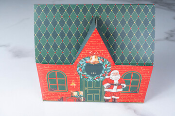 Christmas house-shaped box with Santa Claus.