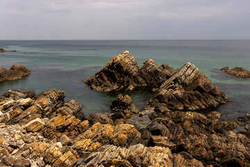 rocks on the beach and cloud

