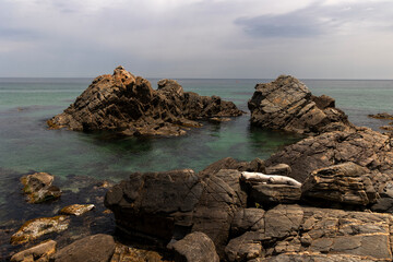rocks on the beach and cloud