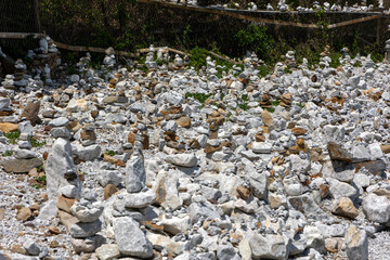 Many small stone towers on the coast