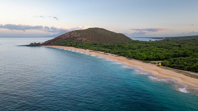 Panoramic Aerial view showcasing Big Beach in Maui, Hawaii Makena state park coastlines and natural landscapes with bright blue ocean waves and sandy beaches