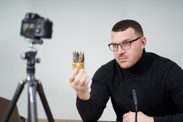 man filming video blog on camera with tripod for online followers. In social media, Influencer, new technology and internet concept