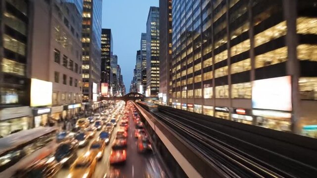 A high-energy, fast-motion timelapse of New York City's dense traffic at night, featuring iconic yellow taxis and bright city lights against a backdrop of towering modern skyscrapers.