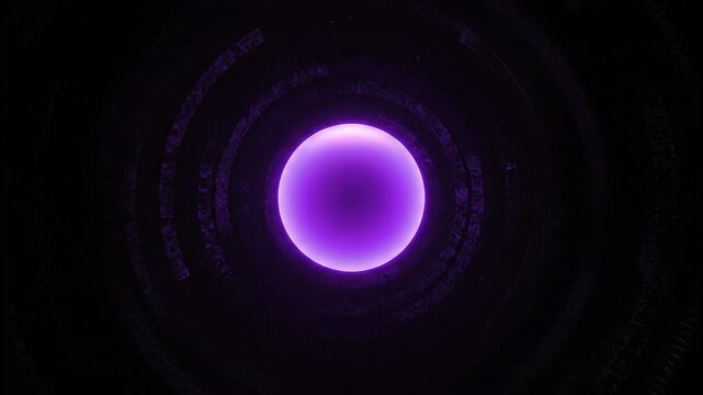 Glowing purple orb on black background.