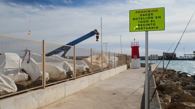 Sign prohibiting drinking in public at the port