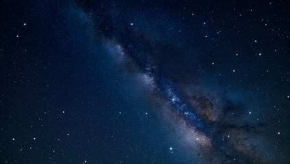 Fototapeta premium Starry night sky with the milky way illuminating the expanse of space