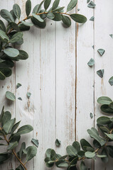 アロマや癒しの雰囲気を作るユーカリと白い木板の縦背景. 生成AI