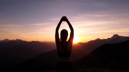 Silhouette of woman practicing yoga at sunset in mountains, peaceful scene - Powered by Adobe