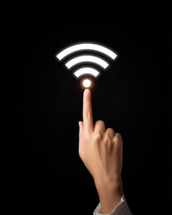  a woman's hand touching the white icon symbol for wi-fi on a black background