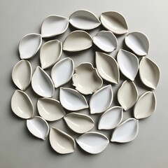 Circular arrangement of ceramic bowls in leaf form creates an elegant pattern