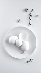 White plate holds three eggs and broken shell, twigs with buds on white surface