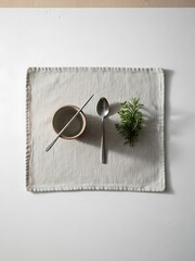 Minimalist Culinary Still Life with Bowl, Spoon, Herb and Cloth Placemat