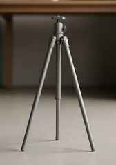 Neutral tone tripod on a light floor, for camera stability and perfect shots