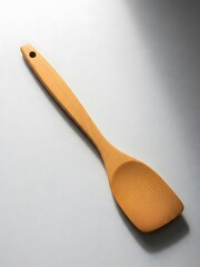 Simple Wooden Spatula for Cooking Preparation on a Textured Surface