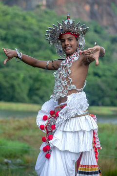SIGIRIYA, SRI LANKA - DECEMBER 05, 2025 : A Ves Dancer, also known as an Up Country Dancer or Kandyan Dancer performs at Sigiriya in Sri Lanka.