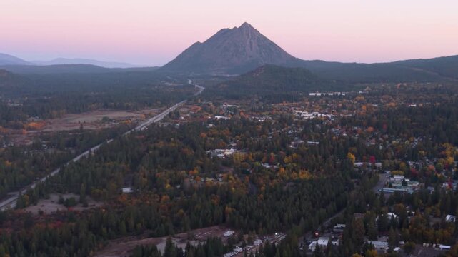 Cinder Cone by Mt Shasta at sunrise, drone view of town in autumn colors.