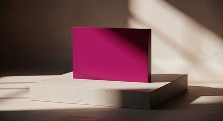 A magenta square object, on a concrete block, lit by dramatic light, with textured background