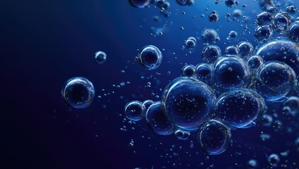 Close-up of luminous blue bubbles and spheres suspended in deep blue liquid