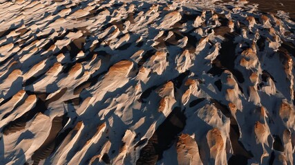 Close of layered pumice rock ridges revealing natural abstract patterns from erosion - Powered by Adobe