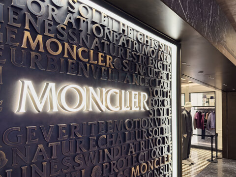 High-end MONCLER store entrance at Singapore Changi Airport featuring elegant signage