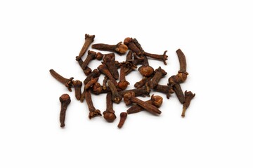 Heap of Dried Cloves Spices Scattered on White Background