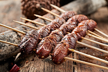 Charcoal-grilled silkworm pupae