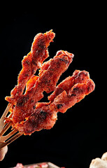 Charcoal-grilled chicken and bone skewers