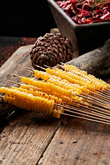Charcoal-grilled corn kernel skewers