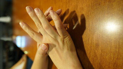 Working Hands of Mature Woman with Visible Finger Joints and Skin Texture