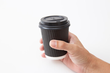 ホットコーヒーを持つ手元