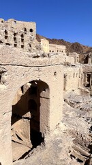 Surveying Historic Ruins In Sunlight, Sunlit Arched Remains And Pathways Highlight Erosion Details Clearly, Erosion Patterns Emerge On Aged Ruins Amid Towering Walkways And Sunlit Landscapes