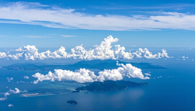 An aerial view of an island island surrounded by calm water under a cloudy sky. - Powered by Adobe