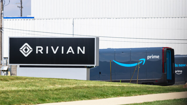 Sign of Rivian, builds an EV all electric sport utility vehicles and produces EDV exclusivly for Amazon, Also shows sign of Amazon in Madison Heights, Michigan.