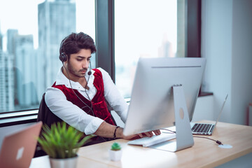 Corporate employee providing professional assistance through headset, clean office design suggesting modern business workflow