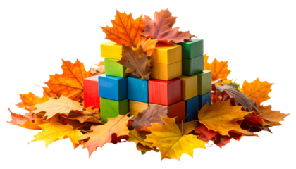 Colorful toy blocks nestled among autumn leaves, warm and inviting