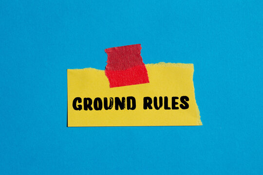 Ground rules message written on ripped torn paper background. Conceptual Ground rules symbol. Copy space.